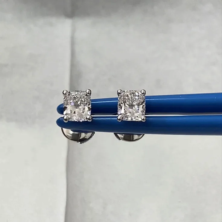 Diamond stud earrings each 1.01 ct.