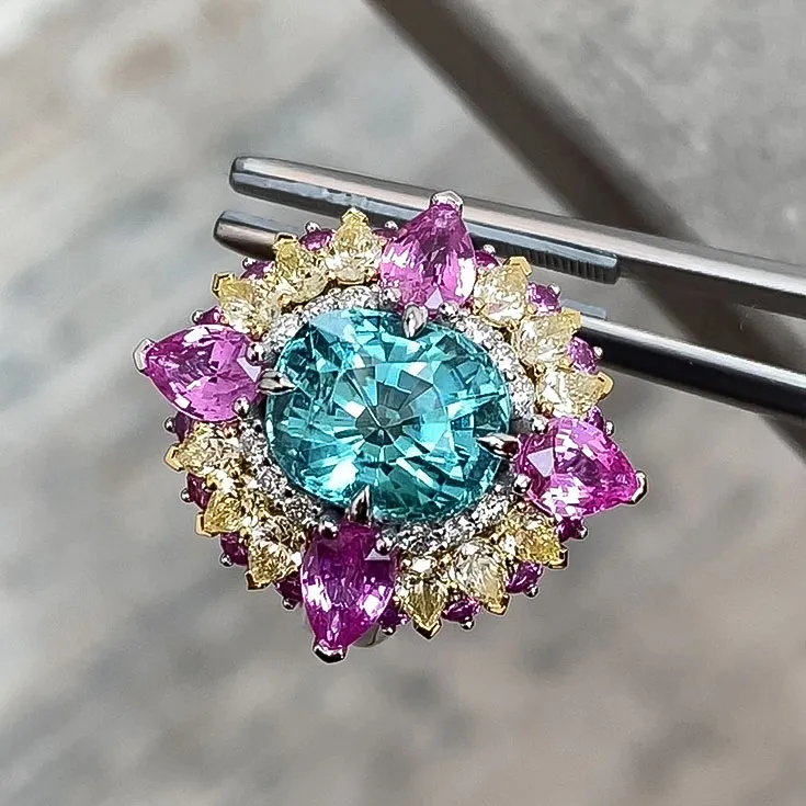 Ring with Lagoon Tourmaline 4.5 ct., Pink and Yellow Sapphires, and colorless Diamonds