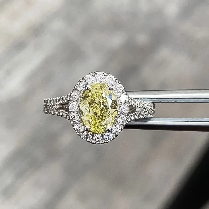 Ring with a Yellow Diamond 1.21 ct. and Colorless Diamond Halo 0.65 ct.