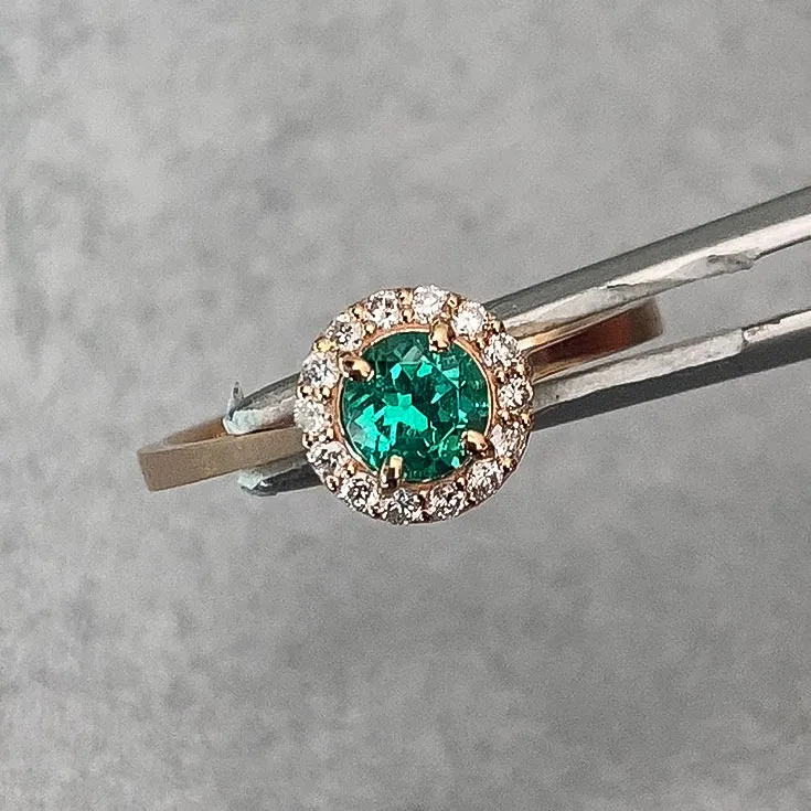 Emerald and Diamond Ring 0.50 ct Emerald in Rose Gold Halo