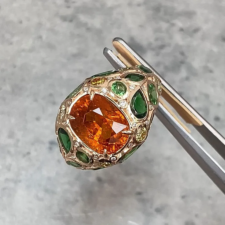 Oval Spessartine Ring with Artistic Botanical Design in Tsavorites, Yellow Diamonds, and White Diamonds