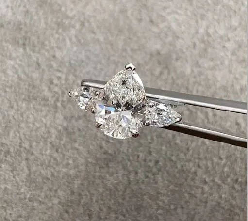 Gold ring with pear-shaped diamonds 3.66 ct.