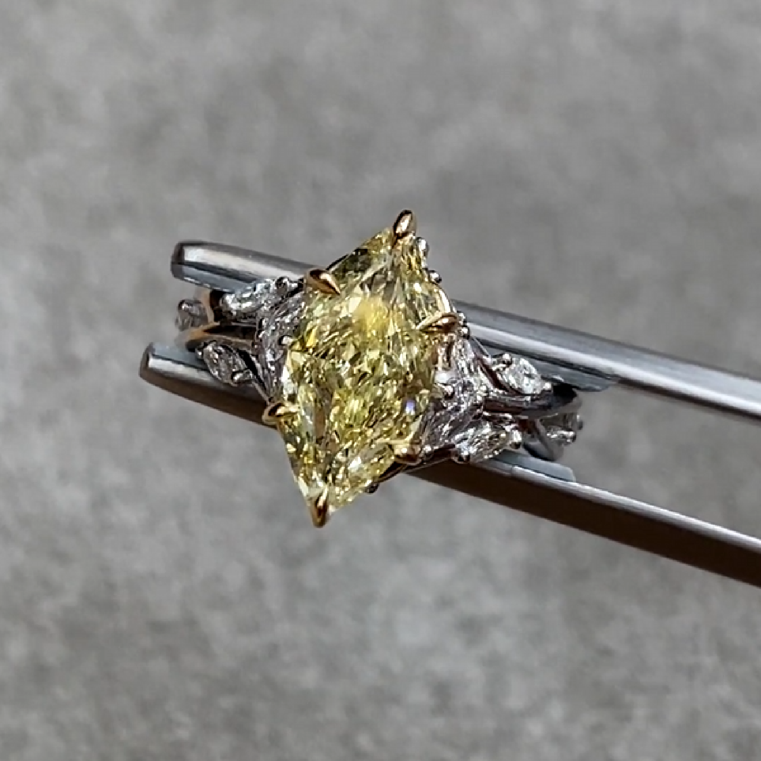 Yellow Marquise Diamond Ring 1.35 ct with Mele Diamonds 0.4 ct.