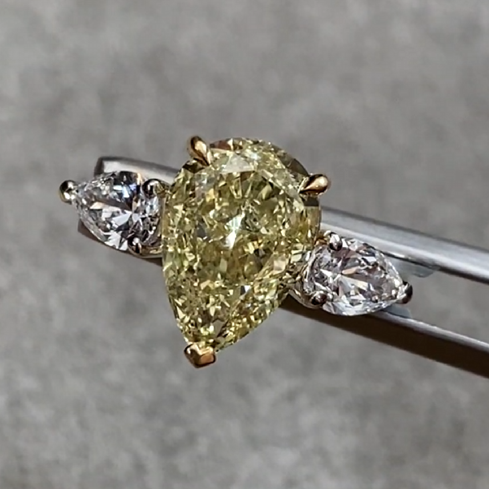 Pear Shape Yellow Diamond 3.01 ct. Ring with Side Pear Diamonds ~ 0.67 ct.